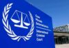War Crimes Verdict Shocks Balkans International Criminal Court sign with scales emblem outside modern building