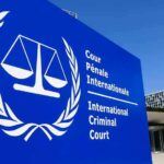 War Crimes Verdict Shocks Balkans International Criminal Court sign with scales emblem outside modern building