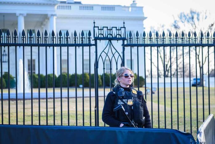 Security officer stands guard outside a large white government building