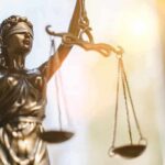 Baby In Oven – Murder Charge Scrapped Lady Justice statue holding balanced scales