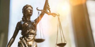 Baby In Oven – Murder Charge Scrapped Lady Justice statue holding balanced scales