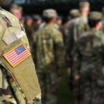 Drug War Goes Hot Inside Ecuador Soldier in camouflage with U.S. flag patch at formation