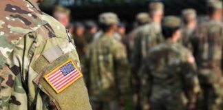Drug War Goes Hot Inside Ecuador Soldier in camouflage with U.S. flag patch at formation