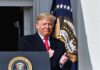 Future Alliance Taunts Draw Trump Fire man in suit clapping at a podium with presidential seal