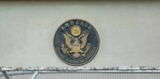U.S. embassy seal on a building wall