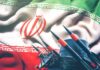Iran Warns: Indian Ocean Erupts Next Iranian flag behind a battery of missiles and radar equipment