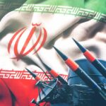Iranian flag behind a battery of missiles and radar equipment