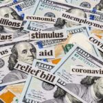 Pandemic Heist Still Bleeding Taxpayers Hundred-dollar bills with cutout words about stimulus and economy