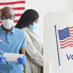 Bridge Chaos Ends A Governor’s Career Voters wearing masks at a polling station