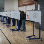 Federal Muscle at Ballot Boxes? Voters at polling booths in a gymnasium