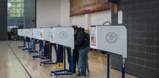 Federal Muscle at Ballot Boxes? Voters at polling booths in a gymnasium