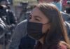 woman in black face mask outdoors