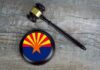 Hobbs Probe Ends With A Surprising Turn Judge's gavel beside a base featuring the Arizona state flag