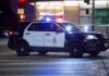 Live-News Flight Ends In Flames Police SUV blocks an intersection at night with lights flashing