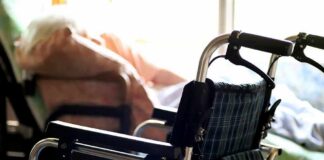 Elder Neglect Claim Turns Deadly wheelchair near a bed in a sunlit room