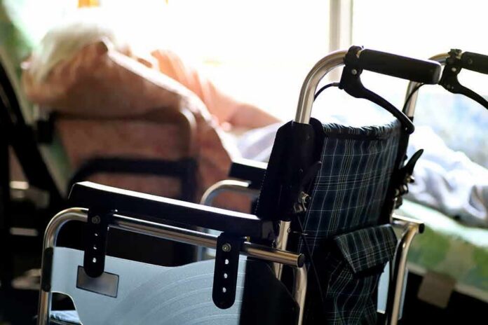 shutterstock_2141353121 wheelchair near a bed in a sunlit room
