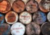 Fuel Shock: China Drives Russian Oil Spike Rusty oil barrels stacked in rows