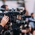 Feminist Icon Gloria Steinem Dies At 92 Video cameras on tripods at a media event