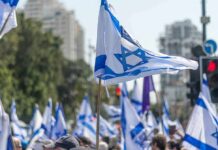 A New Rival Emerges For Netanyahu Israeli flags waved at a street demonstration