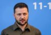 UN Shock: Zelensky Triggers Seoul Backlash man in olive shirt against blue background