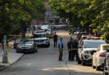 Catch-And-Release Tied To Deadly Stalking Police officers secure a residential street with patrol cars and yellow tape