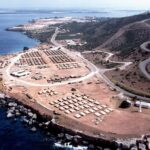 Travel Warning Over A NATO Ally Coastal tent camp on a rocky peninsula