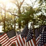 California Campus 9/11 Tribute Defaced American flags displayed outdoors at a memorial