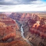 Grand Canyon with river winding through layered red cliffs