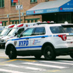Bronx Bullet Shocks City, Protests Ignite Police car and ambulances outside emergency room entrance.