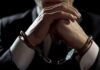 Road-Rage Tirade Engulfs House Hopeful Businessperson in handcuffs with hands clasped