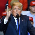 Trump Takes Aim At Three Major Fronts Donald Trump speaking at a rally with supporters in the background