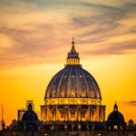 Rome Braces: Pope Heads To OR St. Peter's Basilica dome at sunset