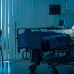 Euthanasia Spike – Oversight Loop Exposed hospital room with child in bed and adult sitting nearby