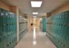 School hallway with rows of teal lockers
