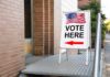 Court’s Hard Line Freezes Student Voting Sidewalk sign with American flag directing to a polling place