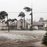 Rapid Intensification THREATENS Gulf Cities Houses battered by hurricane winds and flooding