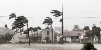 Rapid Intensification THREATENS Gulf Cities Houses battered by hurricane winds and flooding