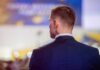 10,000 Threat Cases Since January Man in suit with earpiece at event