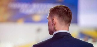 Man in suit with earpiece at event