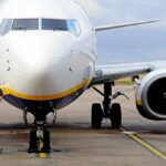 Inside-Job Threat Rattles Flight Deck Passenger jet parked on tarmac front view
