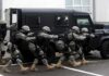A Deadly Strike Raises Alarming Questions Tactical team advances beside an armored vehicle