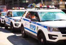 Pregnant Mom Torched In Front Of Child NYPD police SUVs parked in a row on a city street