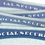 Treasury Dangles $1,000 – Who Qualifies? Social Security cards stacked in a close-up view
