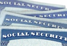 Treasury Dangles $1,000 – Who Qualifies? Social Security cards stacked in a close-up view