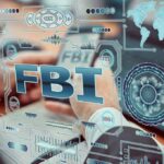 U.S. Arrest Rocks Canadian Massacre Case Hands typing on a laptop with digital cybersecurity graphics overlay