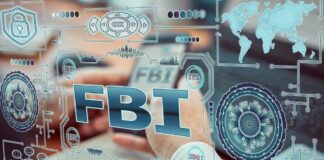 U.S. Arrest Rocks Canadian Massacre Case Hands typing on a laptop with digital cybersecurity graphics overlay
