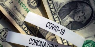 Miami Boss Admits $500M Swindle U.S. dollar bills with labels reading COVID-19 and coronavirus