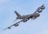 Military bomber aircraft banking in flight