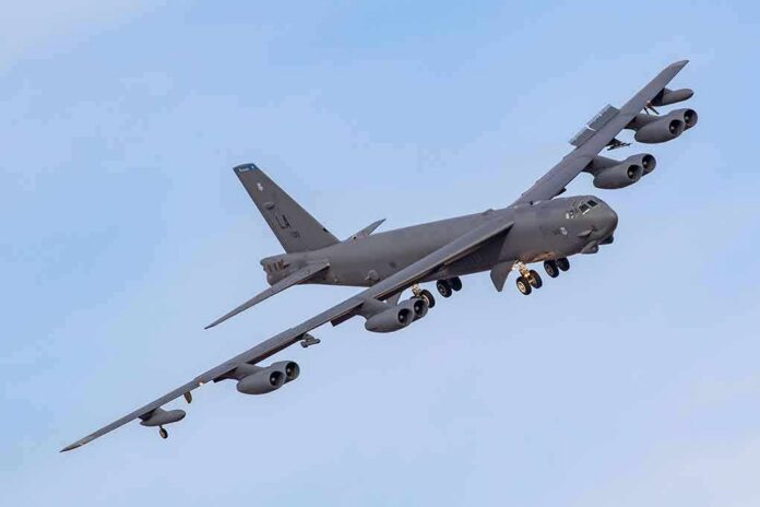 shutterstock_1691982994 Military bomber aircraft banking in flight