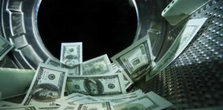 $74M Tax Grab Exposes IRS Weak Spot US dollar bills inside a washing machine drum